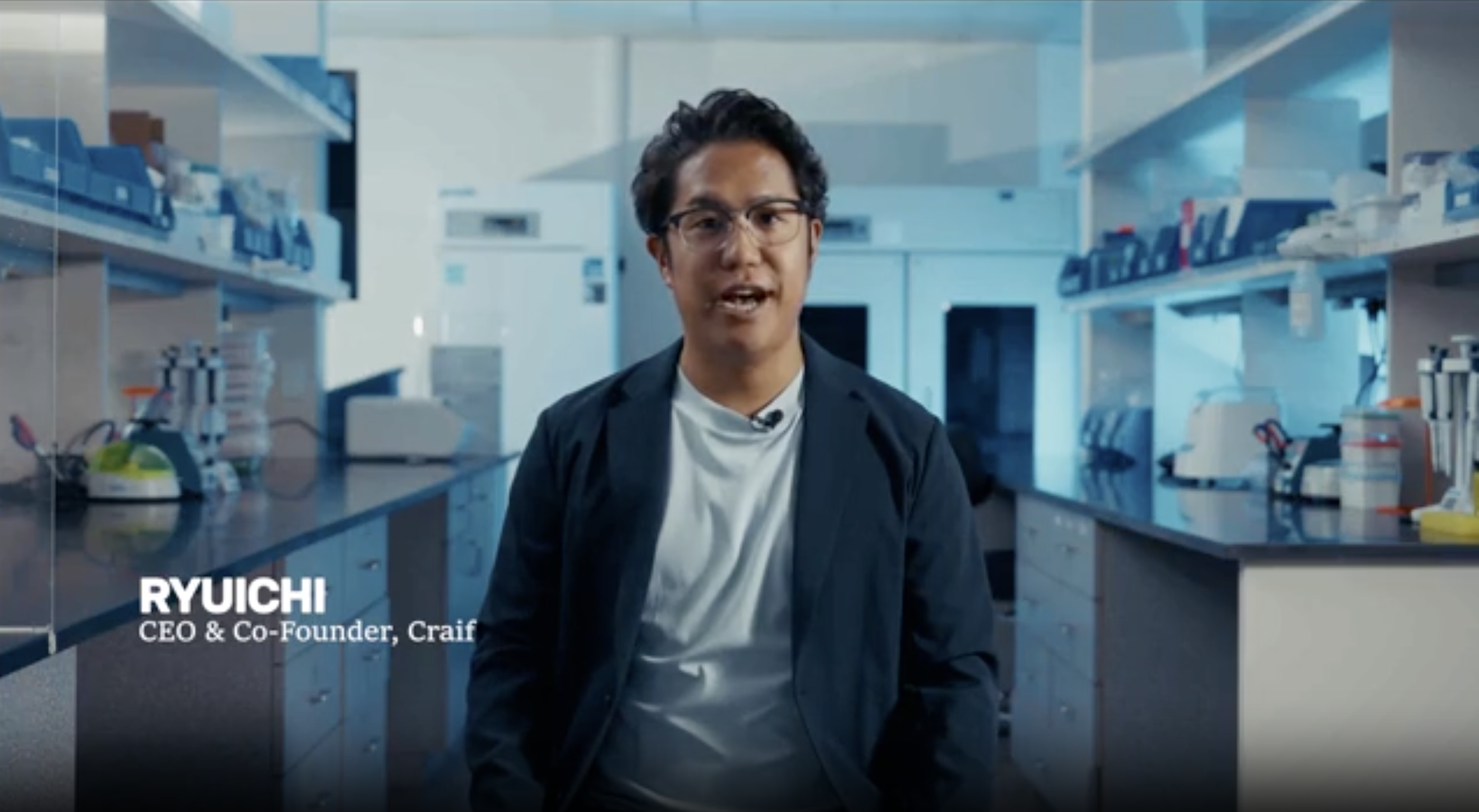 Ryuichi, CEO and co-founder of Craif, speaking in a lab, with his name and title on screen.